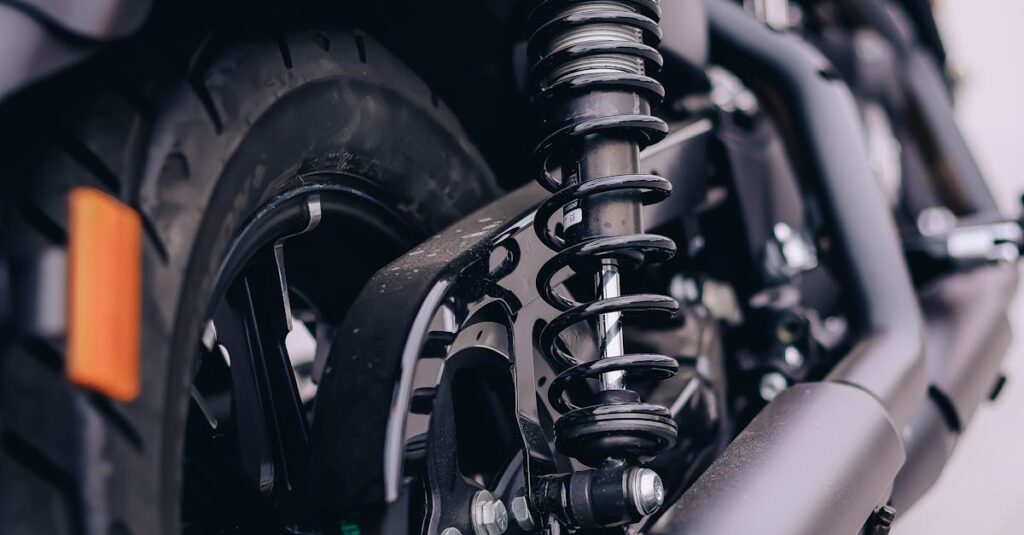 Detailed view of a motorcycle's rear wheel and suspension system.